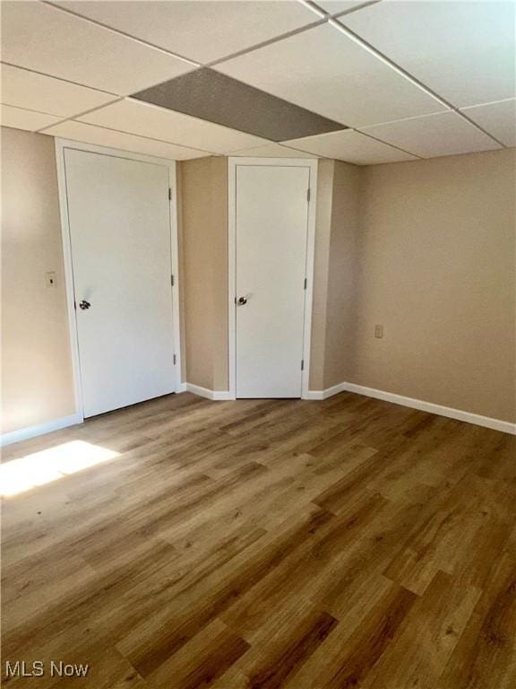 8995 Sarbaugh Rd, Norwich, OH 43767 - interior space with baseboards, a drop ceiling, and wood finished floors