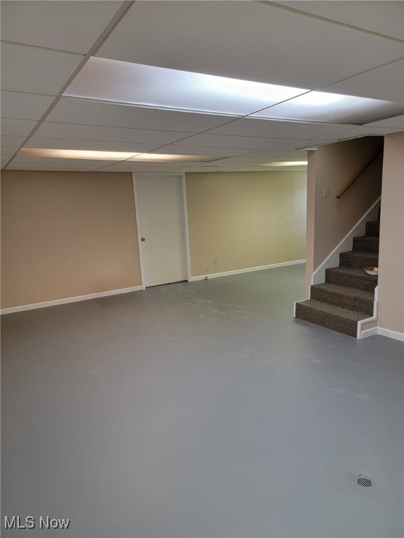 8995 Sarbaugh Rd, Norwich, OH 43767 - finished basement featuring baseboards, a drop ceiling, and stairway