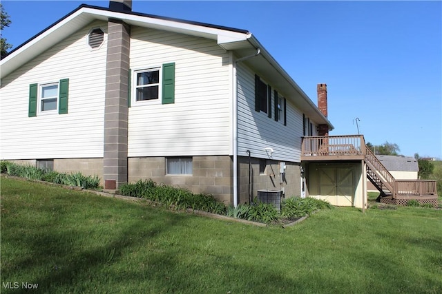 8995 Sarbaugh Rd, Norwich, OH 43767 - back of house with stairs, a deck, a chimney, cooling unit, and a yard