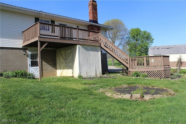 8995 Sarbaugh Rd, Norwich, OH 43767 - back of house with a lawn, a deck, stairway, and a chimney