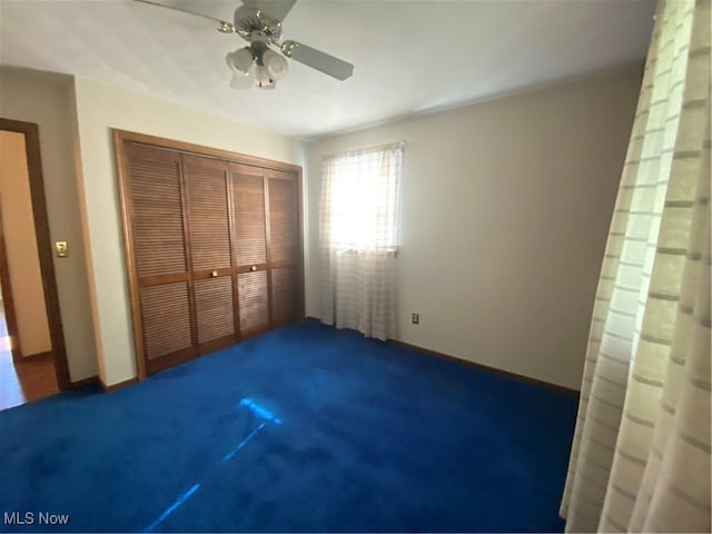 8995 Sarbaugh Rd, Norwich, OH 43767 - unfurnished bedroom featuring ceiling fan, a closet, and carpet flooring