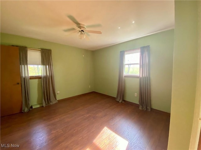 8995 Sarbaugh Rd, Norwich, OH 43767 - empty room featuring a ceiling fan, baseboards, and wood finished floors