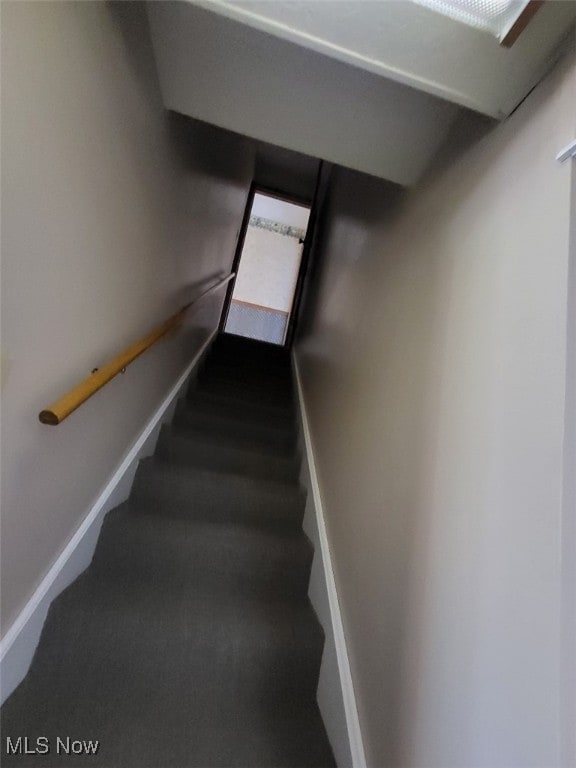 8995 Sarbaugh Rd, Norwich, OH 43767 - staircase featuring carpet flooring and baseboards