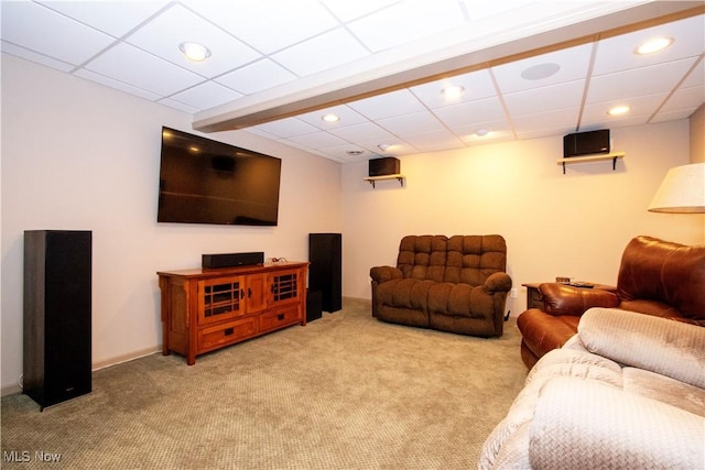living room with carpet floors, recessed lighting, and a paneled ceiling
