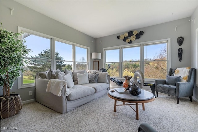 living area with plenty of natural light, carpet flooring, and baseboards