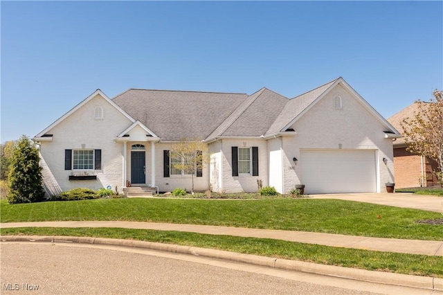 ranch-style house featuring concrete driveway, an attached garage, and a front yard