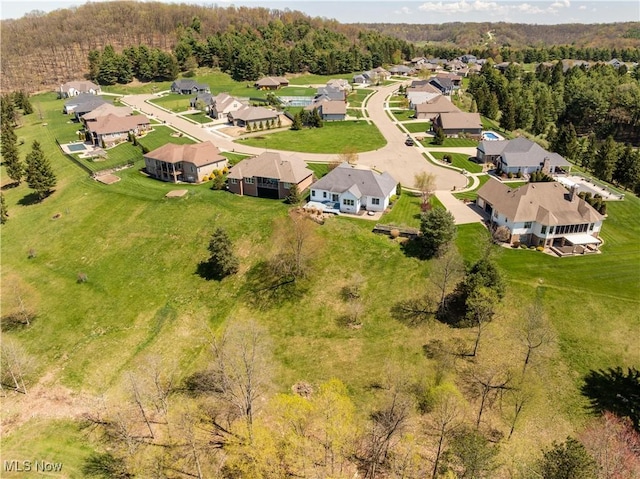 bird's eye view with a view of trees and a residential view
