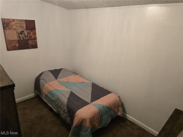 carpeted bedroom featuring baseboards
