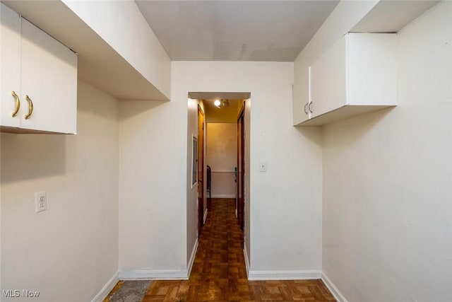 washroom with baseboards
