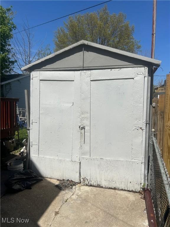 view of shed with fence