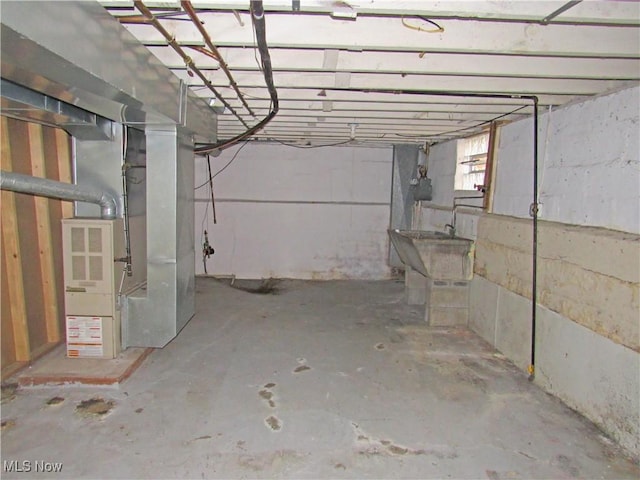 basement featuring heating unit