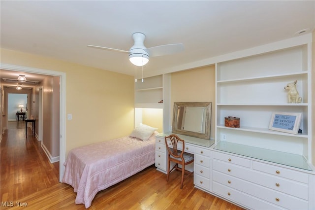 bedroom with ceiling fan and light wood-style flooring