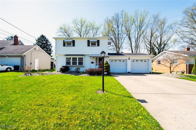 colonial home featuring a garage, a front yard, and concrete driveway