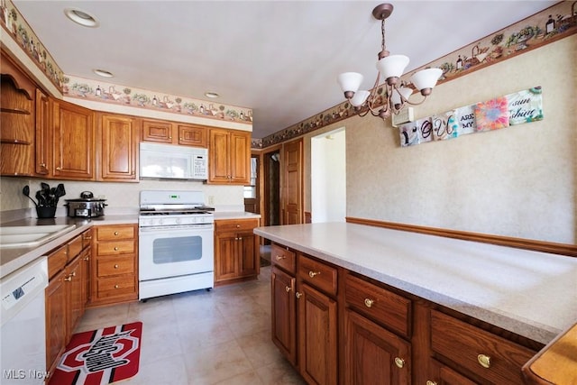 kitchen featuring brown cabinets, open shelves, white appliances, light countertops, and a chandelier