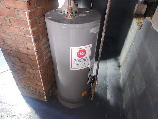utility room featuring gas water heater