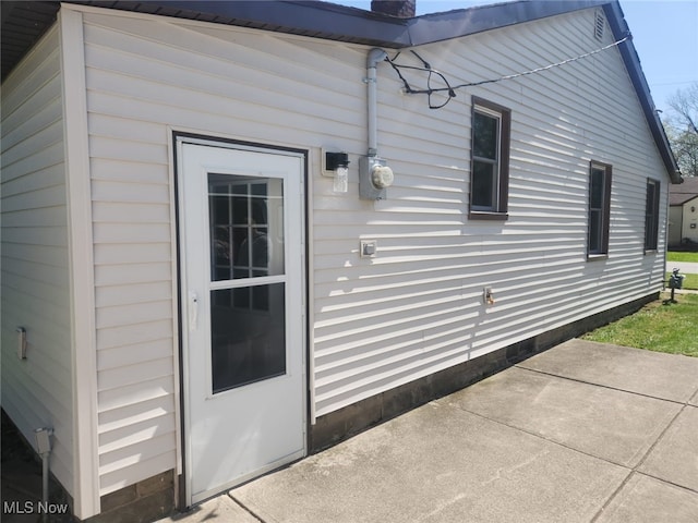 property entrance with a patio