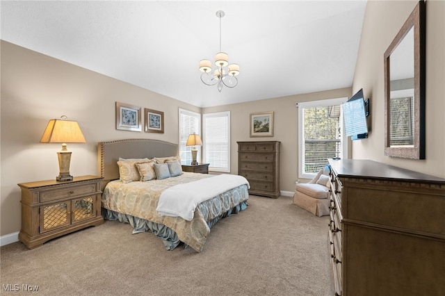 bedroom with baseboards, a chandelier, and light carpet