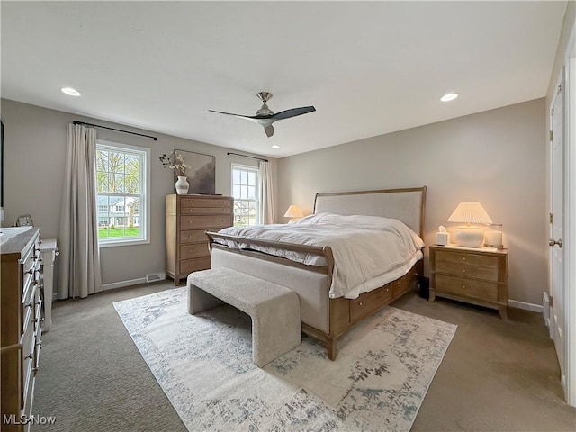 carpeted bedroom with recessed lighting, ceiling fan, visible vents, and baseboards