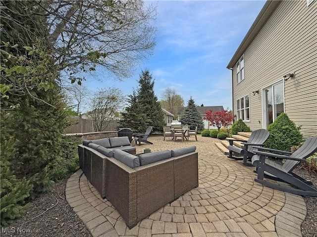 view of patio with fence, outdoor lounge area, and outdoor dining area