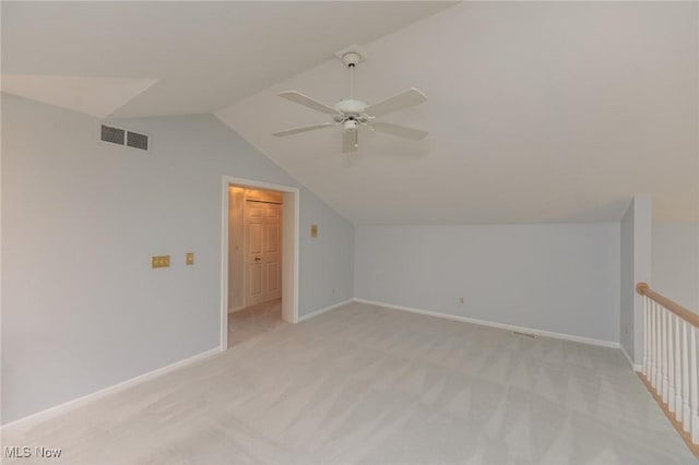 117 Royal Oak Dr, Aurora, OH 44202 - additional living space with light carpet, a ceiling fan, baseboards, lofted ceiling, and visible vents