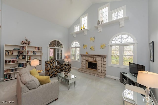 117 Royal Oak Dr, Aurora, OH 44202 - carpeted living room with high vaulted ceiling, a wealth of natural light, and a fireplace
