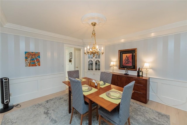 117 Royal Oak Dr, Aurora, OH 44202 - dining room featuring crown molding, a chandelier, and light wood-type flooring
