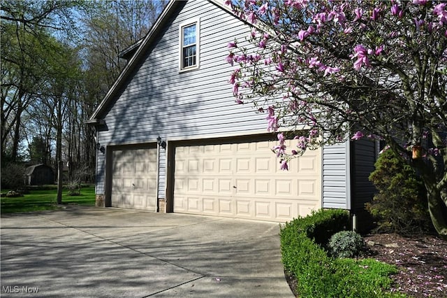 view of side of property featuring driveway