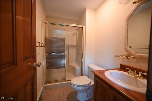 full bathroom with toilet, a shower stall, tile patterned flooring, and vanity