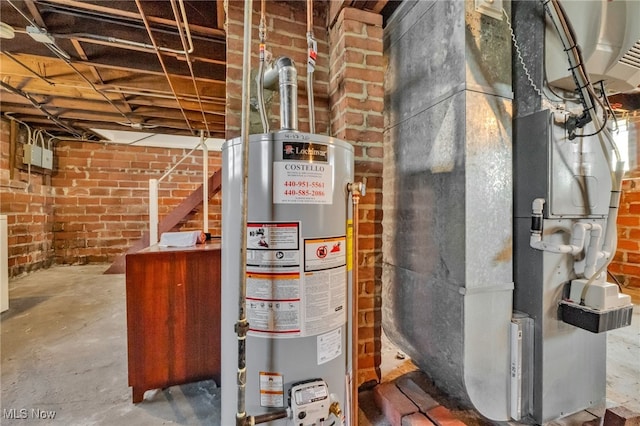 utility room with heating unit and water heater