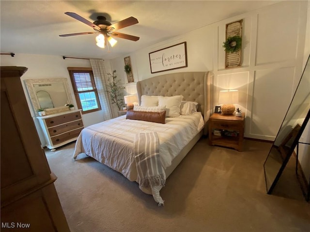 bedroom with a ceiling fan and carpet