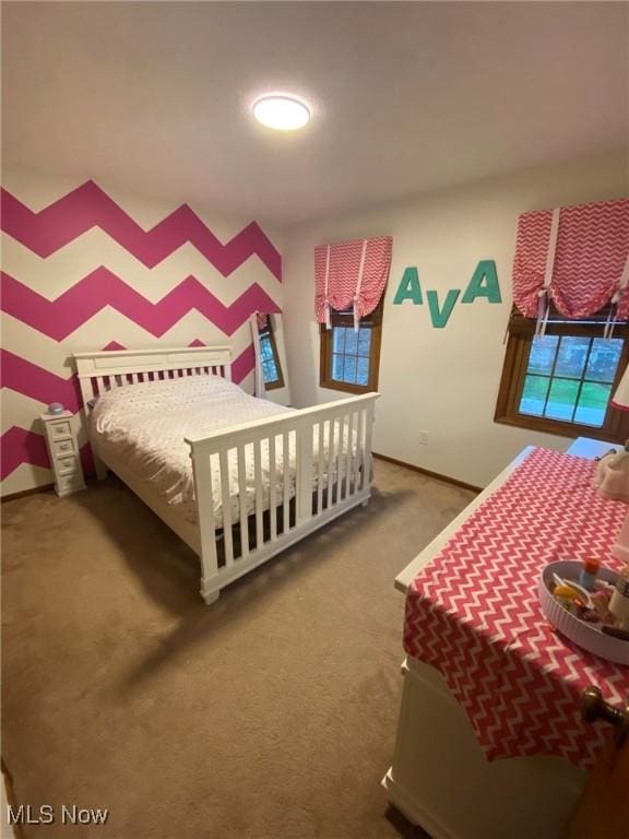 bedroom with baseboards and carpet flooring