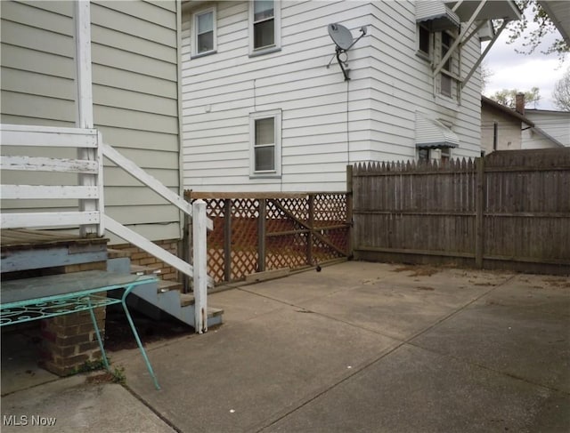 view of patio / terrace featuring fence