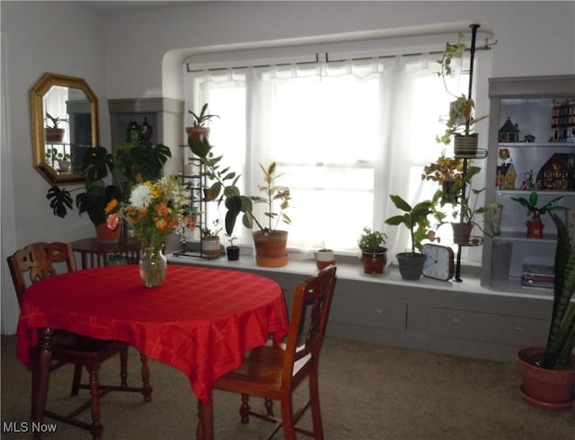 view of carpeted dining area