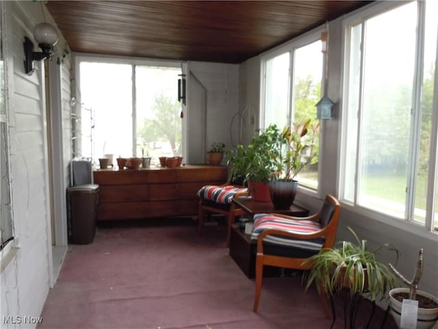 sunroom with wood ceiling and plenty of natural light