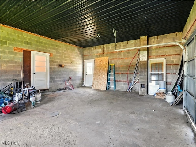 garage featuring concrete block wall