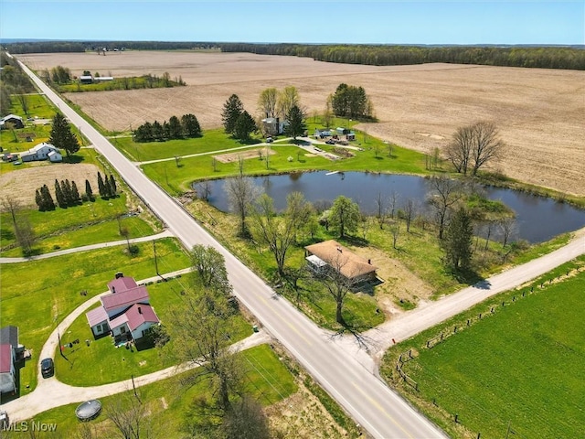 drone / aerial view with a water view and a rural view