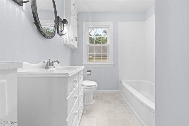 bathroom with toilet, baseboards, tile patterned flooring, and vanity