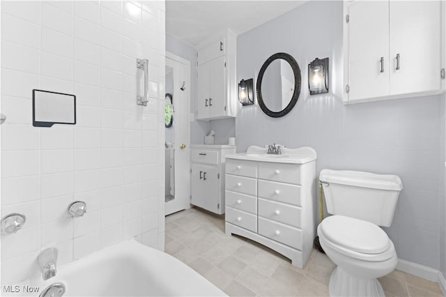 bathroom featuring toilet and vanity