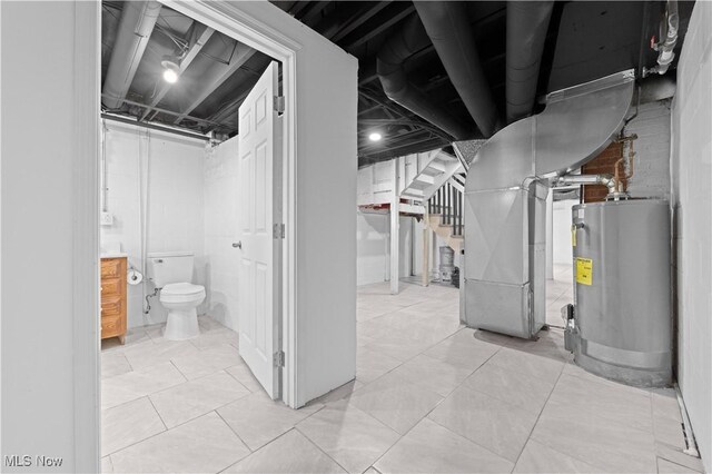 unfinished below grade area with stairway, heating unit, and water heater