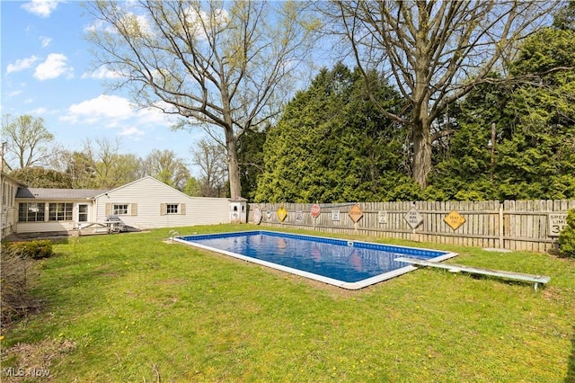 view of swimming pool with a fenced backyard, a fenced in pool, and a yard