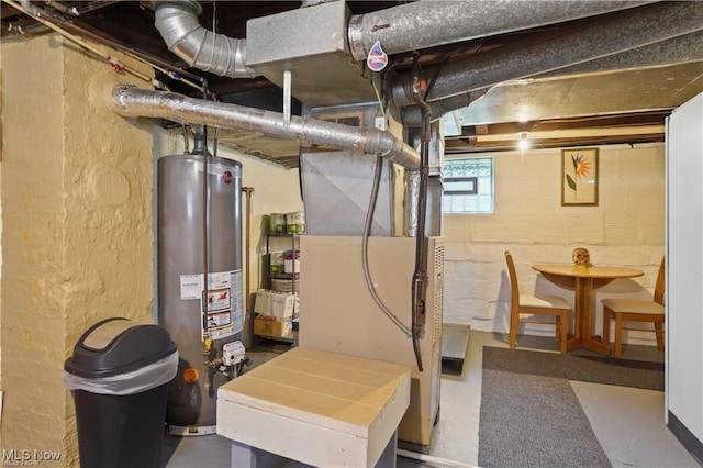 utility room featuring water heater and heating unit