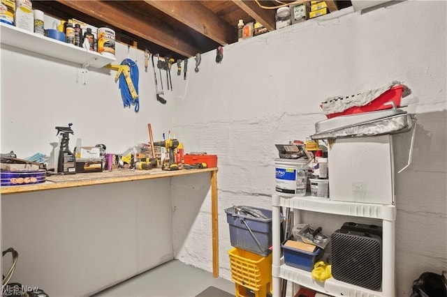 interior space featuring a workshop area and finished concrete flooring