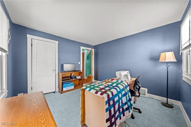 carpeted bedroom with baseboards and visible vents