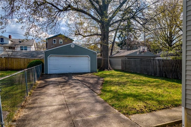 detached garage featuring fence