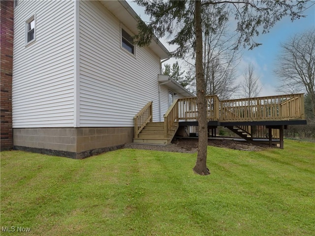 view of yard with a wooden deck and stairs