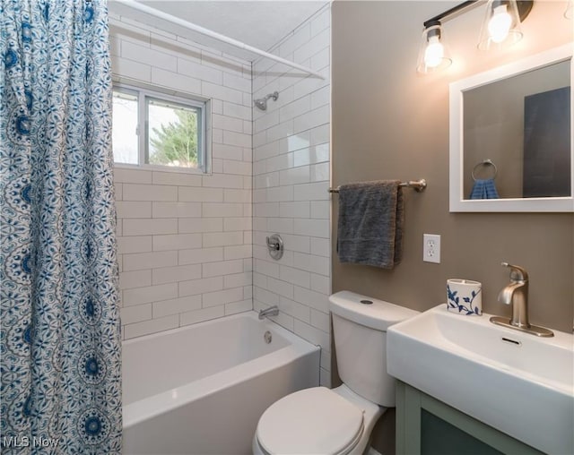 full bathroom featuring vanity, shower / bathtub combination with curtain, and toilet