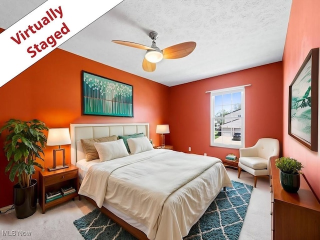 bedroom with ceiling fan and carpet flooring