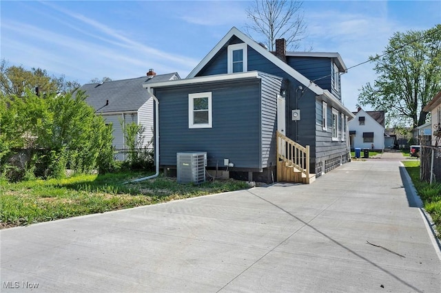 4394 W 139th St, Cleveland, OH 44135 - exterior space featuring entry steps, fence, central AC unit, and a chimney