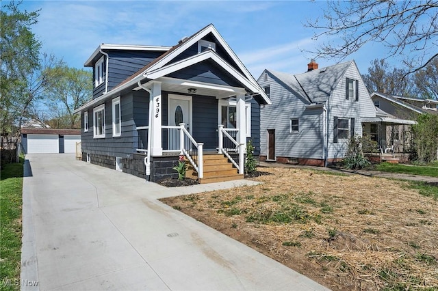 4394 W 139th St, Cleveland, OH 44135 - view of front facade with a detached garage, covered porch, and an outdoor structure