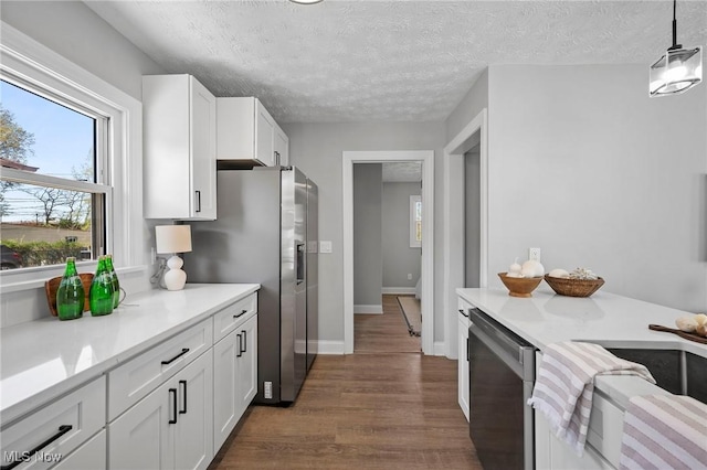 4394 W 139th St, Cleveland, OH 44135 - kitchen featuring plenty of natural light, white cabinetry, appliances with stainless steel finishes, and dark wood finished floors